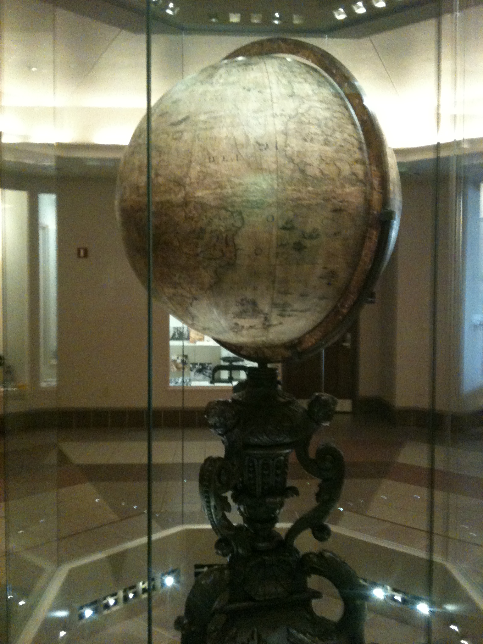 A globe on its stand in the workshop